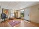 Inviting living room featuring wood floors, chair and ample natural light at 3006 Northwood Blvd, Winter Park, FL 32789