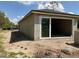 Exterior showcasing a building, including a sliding glass door under construction in the yard at 3027 Turkey Ave, Oviedo, FL 32765