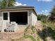 Garage under construction showcasing concrete blocks, open doorway, and a new roof at 3027 Turkey Ave, Oviedo, FL 32765