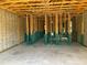 Unfinished interior space features concrete flooring, wood framing, and concrete block walls with wiring at 3027 Turkey Ave, Oviedo, FL 32765