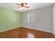 Bedroom featuring hardwood floors, a ceiling fan, and lots of natural light at 323 Marjorie Blvd, Longwood, FL 32750