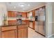 Bright and spacious kitchen featuring stainless steel appliances, granite countertops, and updated cabinetry at 323 Marjorie Blvd, Longwood, FL 32750