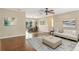 Inviting living room with hardwood floors, neutral paint, and sliding glass doors leading to the outdoors at 323 Marjorie Blvd, Longwood, FL 32750