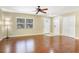 Comfortable living room featuring hardwood floors and natural light from the window at 323 Marjorie Blvd, Longwood, FL 32750