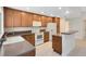 Bright kitchen with light wood cabinets, white appliances, and granite countertops at 3553 Jericho Dr, Casselberry, FL 32707