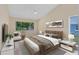 Staged main bedroom with neutral tones, vaulted ceiling, and modern decor at 3553 Jericho Dr, Casselberry, FL 32707