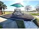 Community playground area with play structure and a padded ground at 3810 Blue Dasher Dr, Kissimmee, FL 34744