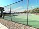 Community tennis court surrounded by fencing, offering a recreational space for residents at 3810 Blue Dasher Dr, Kissimmee, FL 34744