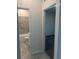 Bathroom with tiled walls, a tub, toilet and light gray tiled floors at 4086 Gooseberry Trl, Kissimmee, FL 34746