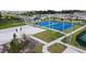 Bright aerial view of community park featuring volleyball, picnic area, and basketball courts at 4086 Gooseberry Trl, Kissimmee, FL 34746