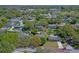 Aerial view of a home nestled in a lush, green neighborhood with mature trees at 412 N Boyd St, Winter Garden, FL 34787