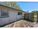 Exterior wood deck featuring an exterior window and privacy fence along the property line at 412 N Boyd St, Winter Garden, FL 34787