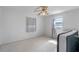 Neutral bedroom featuring two windows, a terrazzo floor and minimalistic decor at 412 N Boyd St, Winter Garden, FL 34787