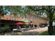 Outdoor dining area with red umbrellas and brick road at commercial building at 412 N Boyd St, Winter Garden, FL 34787