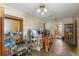 Living room showcasing an open layout, ceiling fan, built-in shelving, and seamless access to adjacent rooms at 412 N Boyd St, Winter Garden, FL 34787