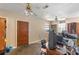 Comfortable living room with a ceiling fan, natural light, and an entry door to the exterior at 412 N Boyd St, Winter Garden, FL 34787