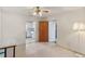 Living room with ceiling fan and view of the kitchen, creating an open feel at 412 N Boyd St, Winter Garden, FL 34787