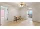 Interior view showing the living room with tile flooring and view to the kitchen at 412 N Boyd St, Winter Garden, FL 34787