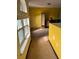 Upstairs hallway with natural light from the nearby window, creating a bright and inviting space at 428 Ohio Ln, Kissimmee, FL 34759