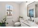 Stylish bathroom with a granite countertop, modern fixtures, and a window that lets in plenty of natural light at 4457 Anson Ln, Orlando, FL 32814