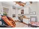 Comfortable home office with a massage chair, custom built-ins, and hardwood floors provides relaxation and workspace at 4457 Anson Ln, Orlando, FL 32814