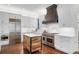 Modern kitchen featuring stainless steel appliances, custom island, and white subway tile backsplash at 4457 Anson Ln, Orlando, FL 32814