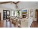 Cozy living room with a stone fireplace, comfortable seating, hardwood floors, and natural light at 4457 Anson Ln, Orlando, FL 32814