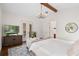 Bright main bedroom showing an elegant chandelier, French doors to the exterior, and a decorative rug at 4457 Anson Ln, Orlando, FL 32814