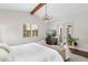 Bright main bedroom exhibiting a decorative rug, elegant chandelier, and French doors to the exterior at 4457 Anson Ln, Orlando, FL 32814