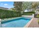 Beautiful pool area with lush greenery providing privacy and a serene outdoor space at 4457 Anson Ln, Orlando, FL 32814