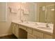 Bathroom with dual sinks, a large mirror, and walk-in shower at 4489 Monado Dr, Kissimmee, FL 34746