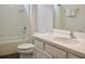 Clean bathroom features a white vanity, toilet, and shower with white subway tile and white shower curtain at 4489 Monado Dr, Kissimmee, FL 34746