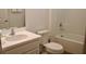 Bathroom featuring a tub and shower combination, toilet, and modern vanity at 4489 Monado Dr, Kissimmee, FL 34746