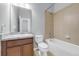 Bathroom with a shower and tub combination, lovely vanity, and neutral colors at 502 Rainbow Springs Loop, Groveland, FL 34736