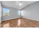 Bright bedroom with ample natural light, featuring hardwood floors and a calming color palette at 502 Rainbow Springs Loop, Groveland, FL 34736