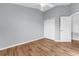 Bedroom features wood floors, a ceiling fan, closet and bright white trim at 502 Rainbow Springs Loop, Groveland, FL 34736