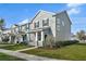 Well-kept townhome featuring a cozy front porch and manicured lawn at 502 Rainbow Springs Loop, Groveland, FL 34736