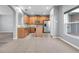 Well-lit kitchen featuring stainless steel appliances and a central island for convenient food preparation at 502 Rainbow Springs Loop, Groveland, FL 34736