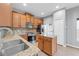 Well-equipped kitchen featuring stainless steel appliances, granite counters, and ample cabinet space at 502 Rainbow Springs Loop, Groveland, FL 34736