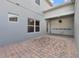 Covered patio with brick pavers for outdoor entertaining at 502 Rainbow Springs Loop, Groveland, FL 34736