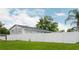 Spacious backyard enclosed by a tall white fence, providing privacy and ample green space at 504 Teakwood Dr, Altamonte Springs, FL 32714