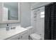 Contemporary bathroom featuring white fixtures and a walk-in shower with a black shower curtain at 504 Teakwood Dr, Altamonte Springs, FL 32714