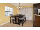 Bright dining area with a wooden table and bench seating near a window at 504 Teakwood Dr, Altamonte Springs, FL 32714