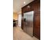 Well-organized kitchen with stainless steel refrigerator and abundant dark wood cabinets at 504 Teakwood Dr, Altamonte Springs, FL 32714