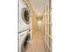 Hallway with a stacked, white washer and dryer at 504 Teakwood Dr, Altamonte Springs, FL 32714