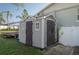 Shed with double doors and windows sits on a large lawn at 504 Teakwood Dr, Altamonte Springs, FL 32714