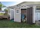 Outdoor storage shed with open door in backyard adjacent to deck with outdoor seating at 504 Teakwood Dr, Altamonte Springs, FL 32714