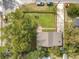 This aerial view showcases the home's fenced yard and proximity to the street at 505 E Plymouth Ave, Deland, FL 32724