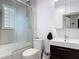 Bathroom featuring sleek fixtures, a glass shower, and modern tile at 505 E Plymouth Ave, Deland, FL 32724