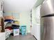 Laundry room featuring a washer, dryer, and storage shelves at 505 E Plymouth Ave, Deland, FL 32724